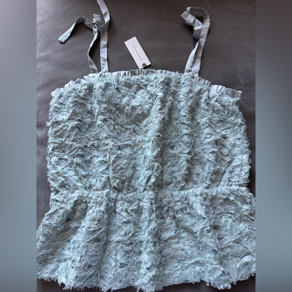 Anthropologie Textured Light Blue Tie-Strap Peplum Top